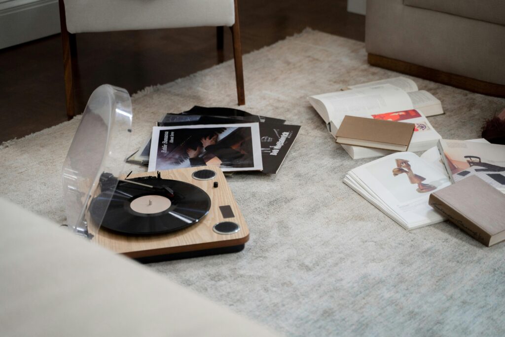 Old Vinyl Recorder, Books and Wallpapers on Floor