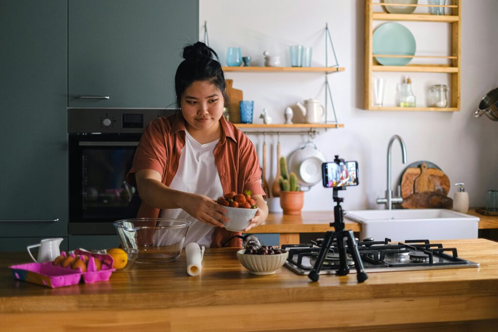 Woman Recording Herself While Cooking