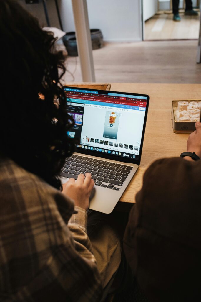 Back View of Woman Working on Laptop