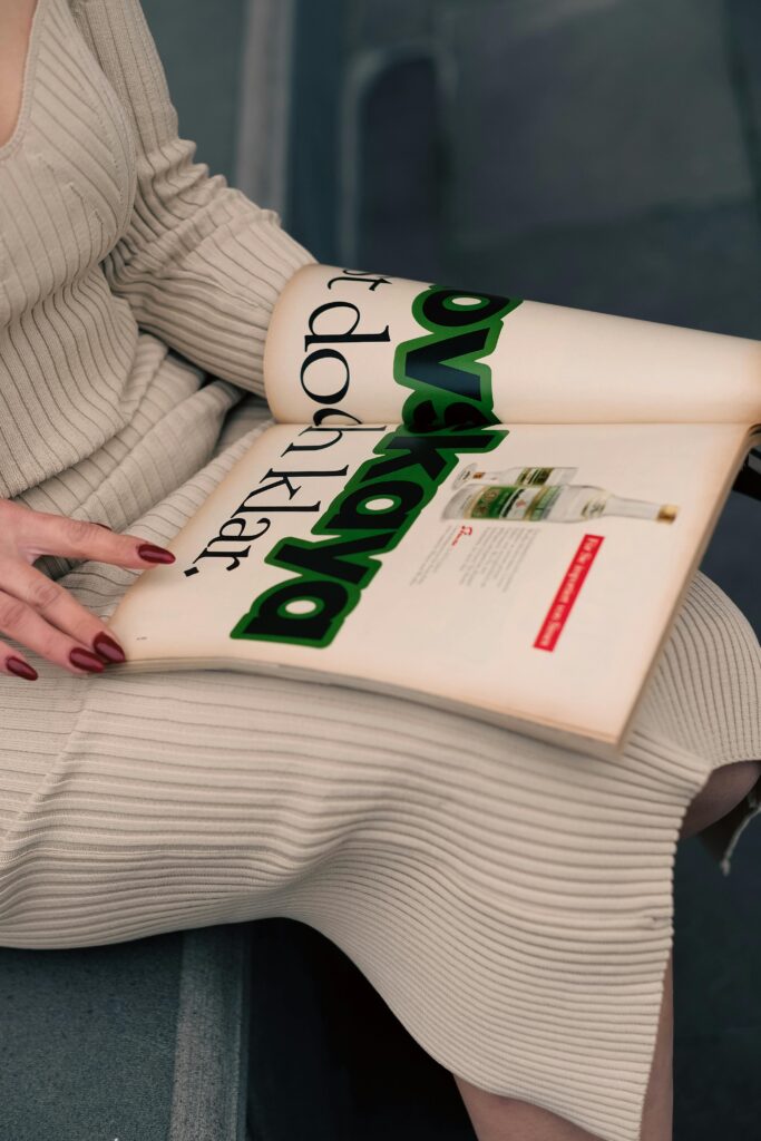 Woman Sitting with Magazine