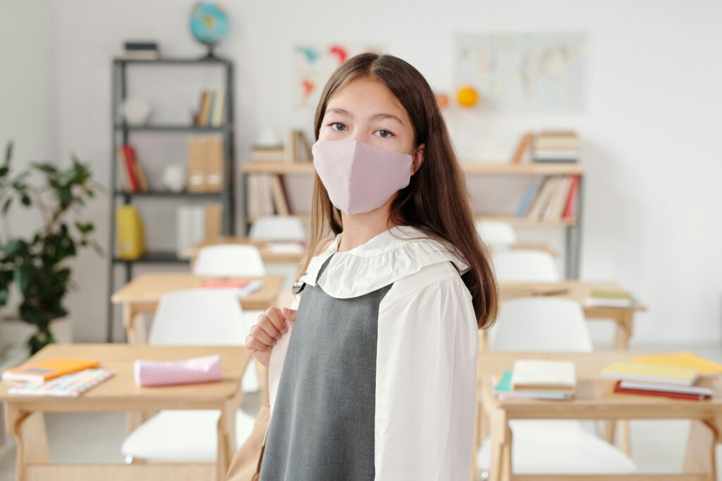 Girl With Face Mask in Blurred Background