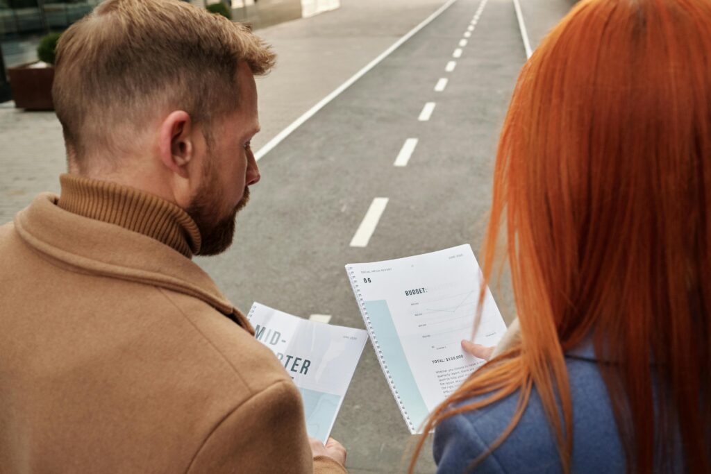 Couple Holding a Notebook