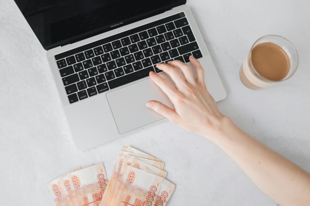 A Person Typing on a Laptop