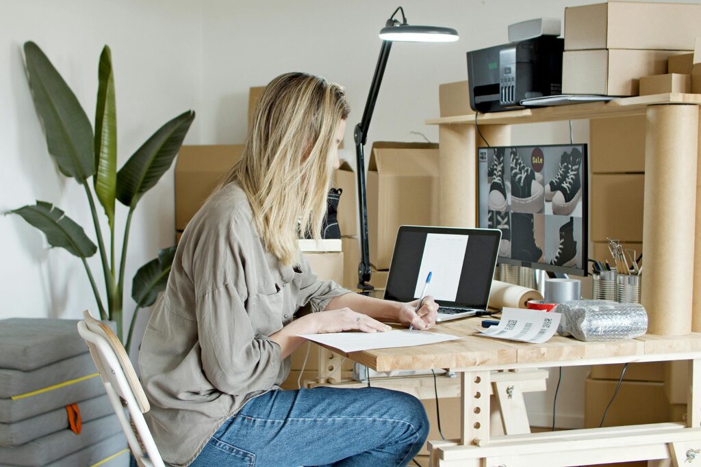 Woman Busy Writing on the Paper