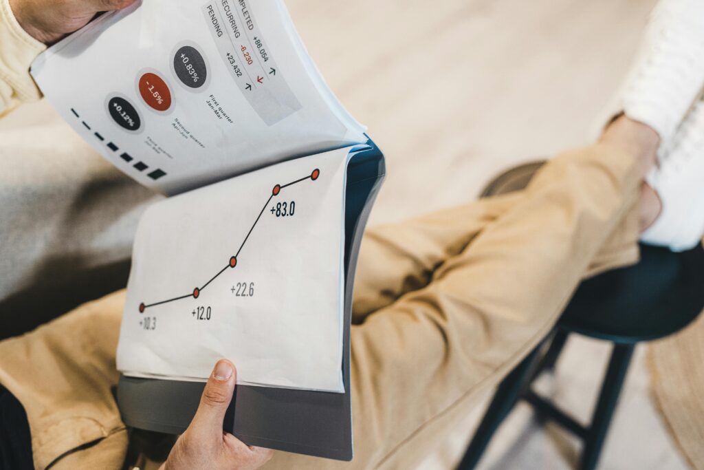 Man Reading Documents with Statistics